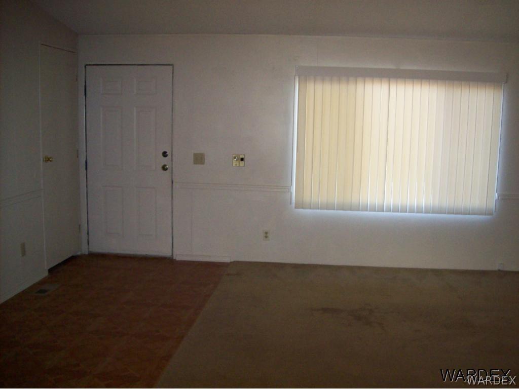 2011 South Estrella Road Golden Valley, AZ 86413 - Photo 4 of 11 living room towards entry door