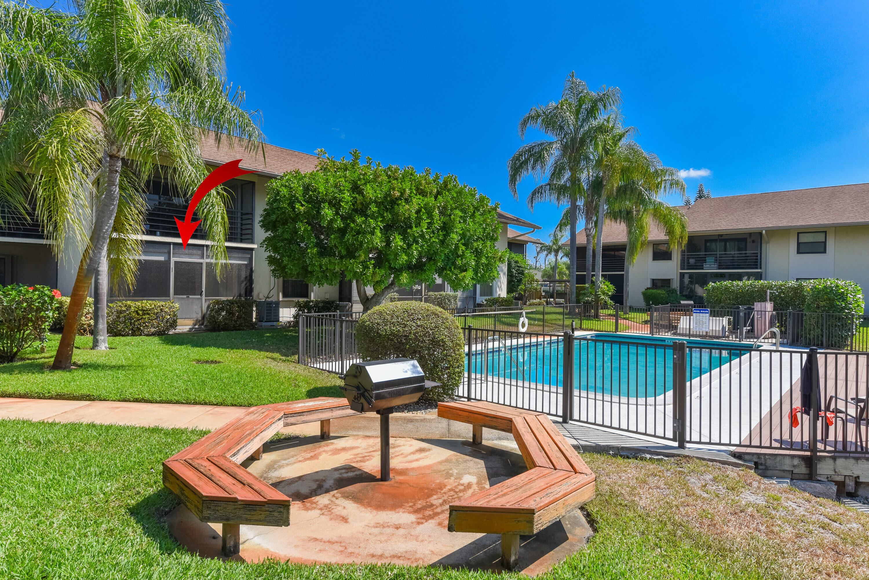 1871 Southwest Palm City Road, Unit G201 Stuart, FL 34994 - Photo 23 of 25 Community pool and BBQ