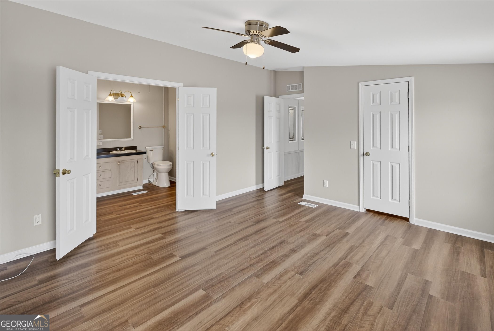 13541 Pine Burr Road Metter, GA 30439 - Photo 19 of 44 a view of a kitchen from the hallway