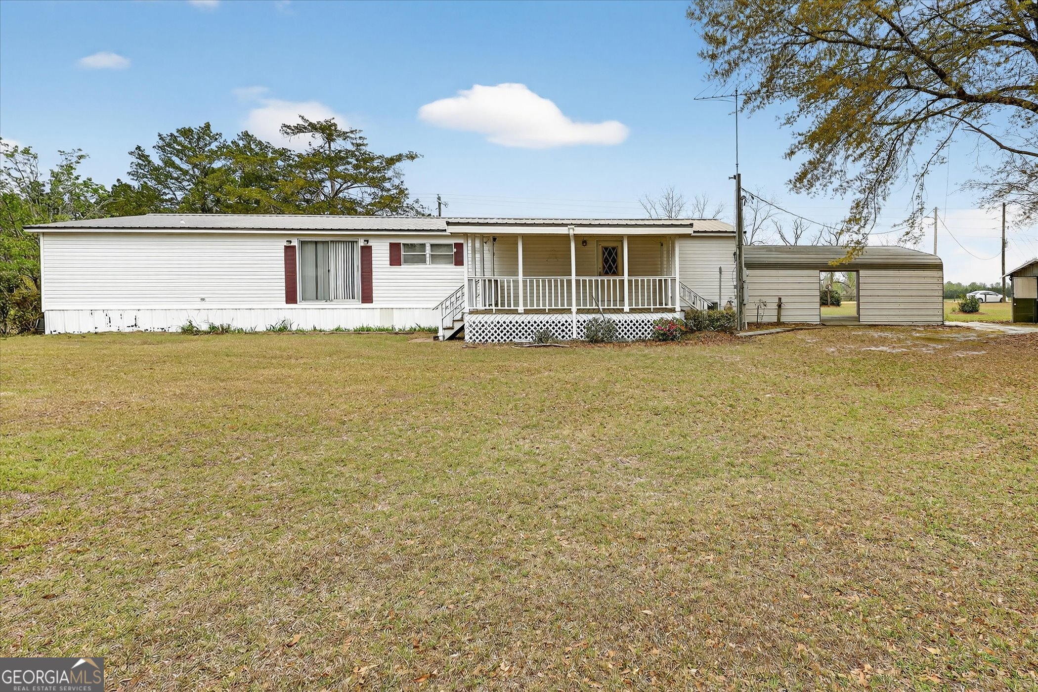 13541 Pine Burr Road Metter, GA 30439 - Photo 33 of 44 a view of a house with outdoor space and sitting area