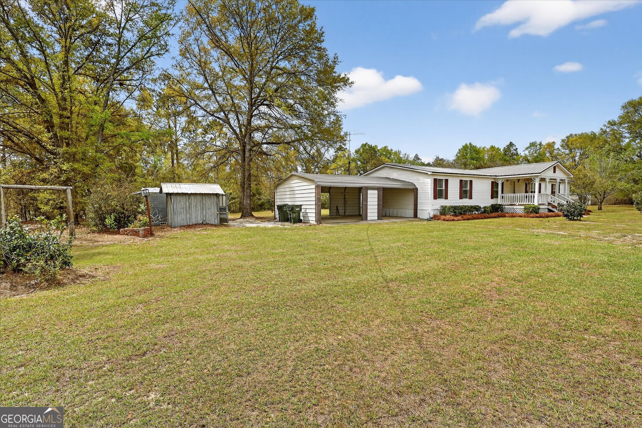 13541 Pine Burr Road Metter, GA 30439 - Photo 36 of 44 a view of a house with yard and sitting area