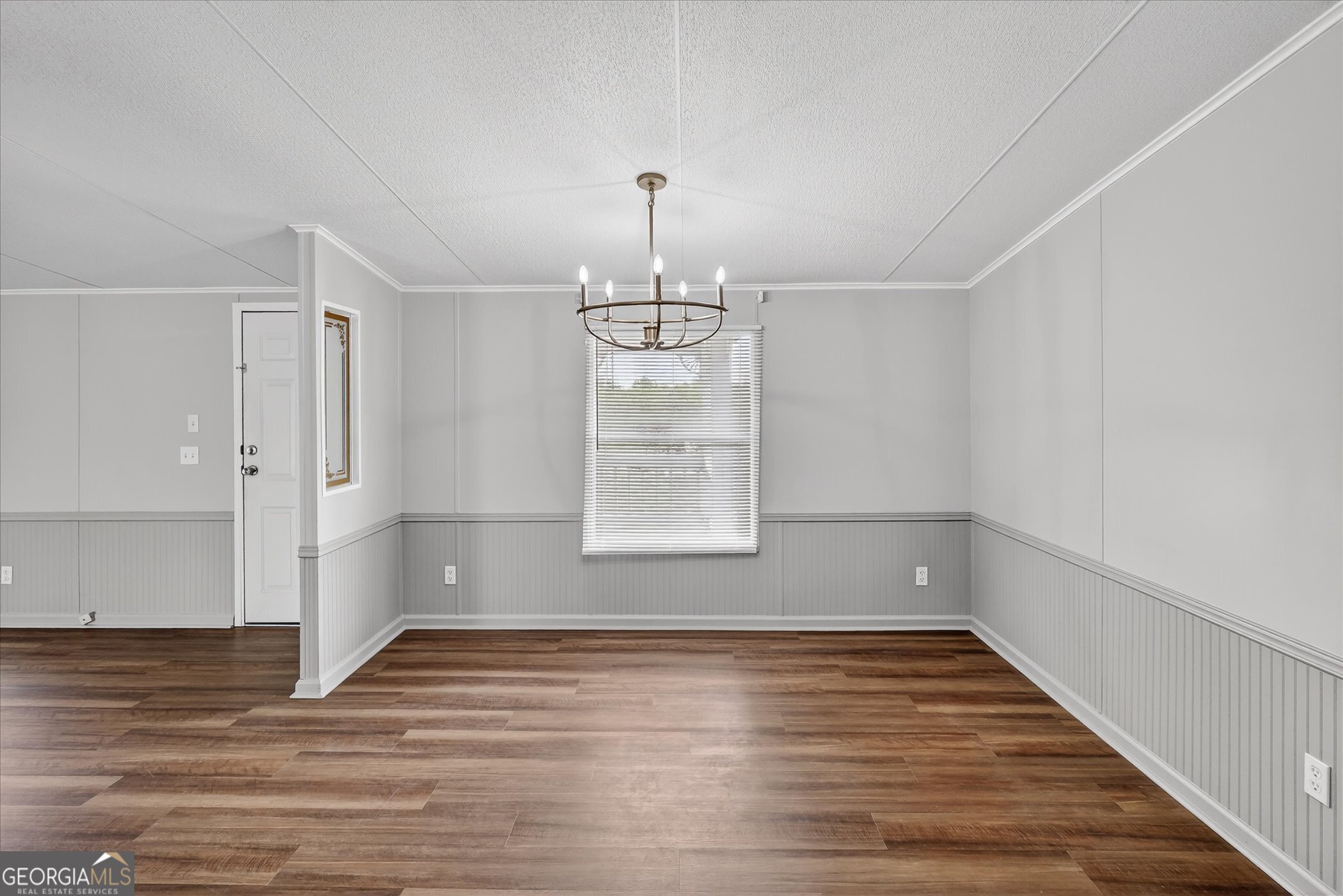 13541 Pine Burr Road Metter, GA 30439 - Photo 10 of 44 a view of empty room with wooden floor and fan