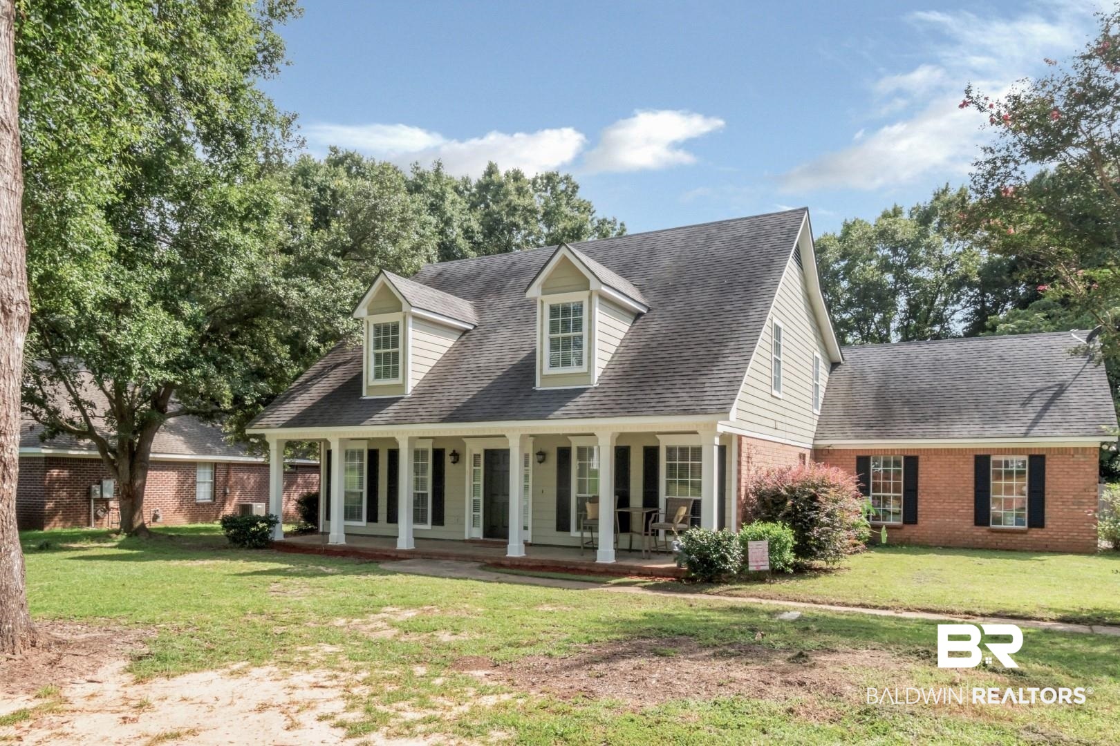 9991 Wedgefield Court Mobile, AL 36608 - Photo 2 of 30 Exterior space with covered porch and a front lawn