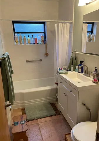 a bathroom with a sink a toilet and a bathtub