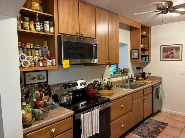a kitchen with a sink and cabinets