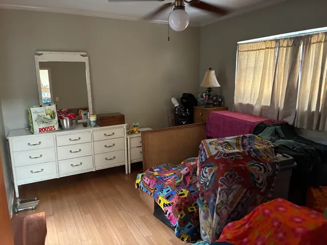 a bed room with a bed and a dresser