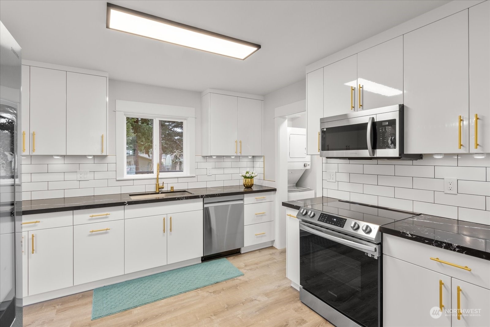 6919 Cady Road Everett, WA 98203 - Photo 11 of 39 a kitchen with stainless steel appliances granite countertop a sink and a stove