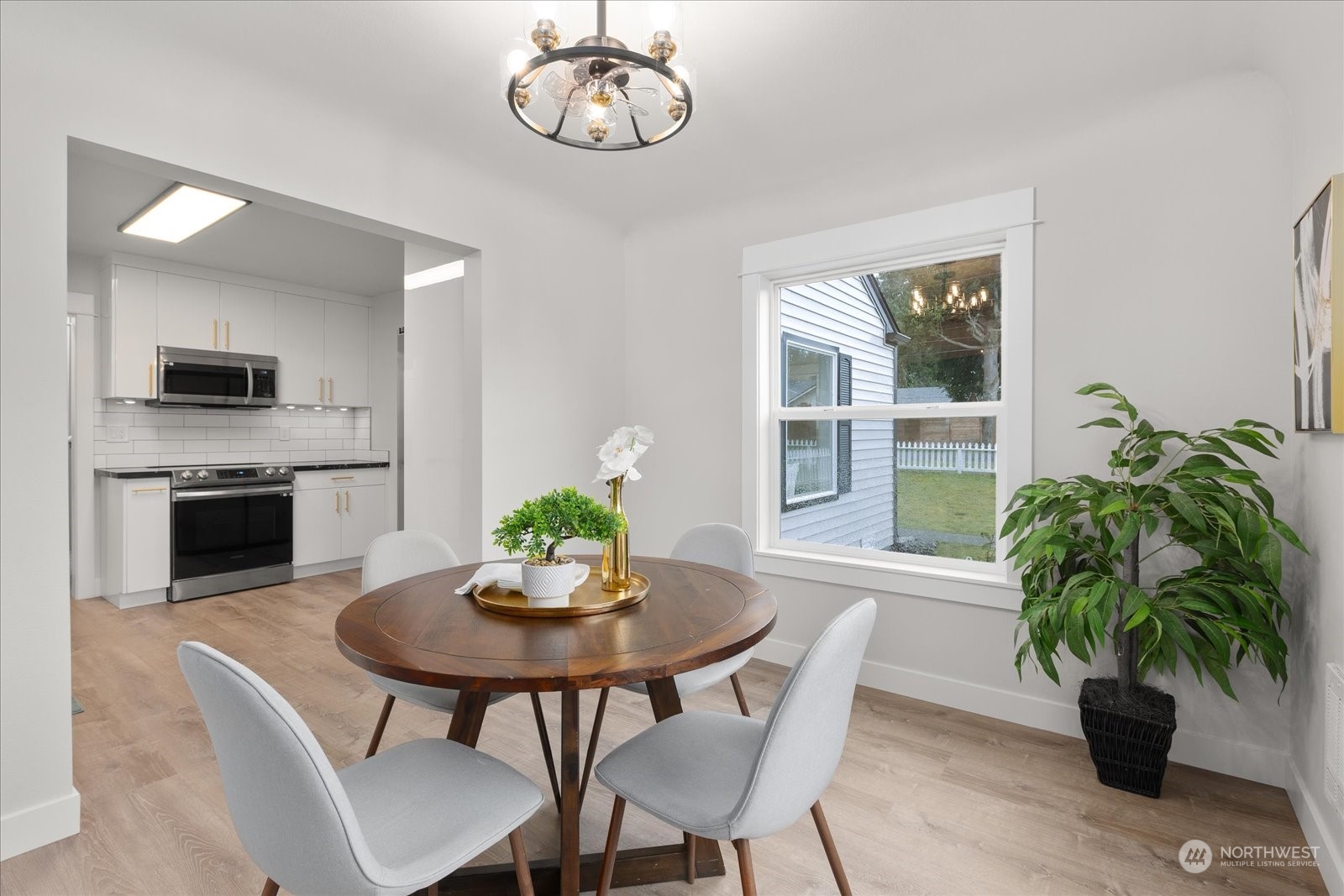 6919 Cady Road Everett, WA 98203 - Photo 14 of 39 a view of a dining room with furniture window and wooden floor