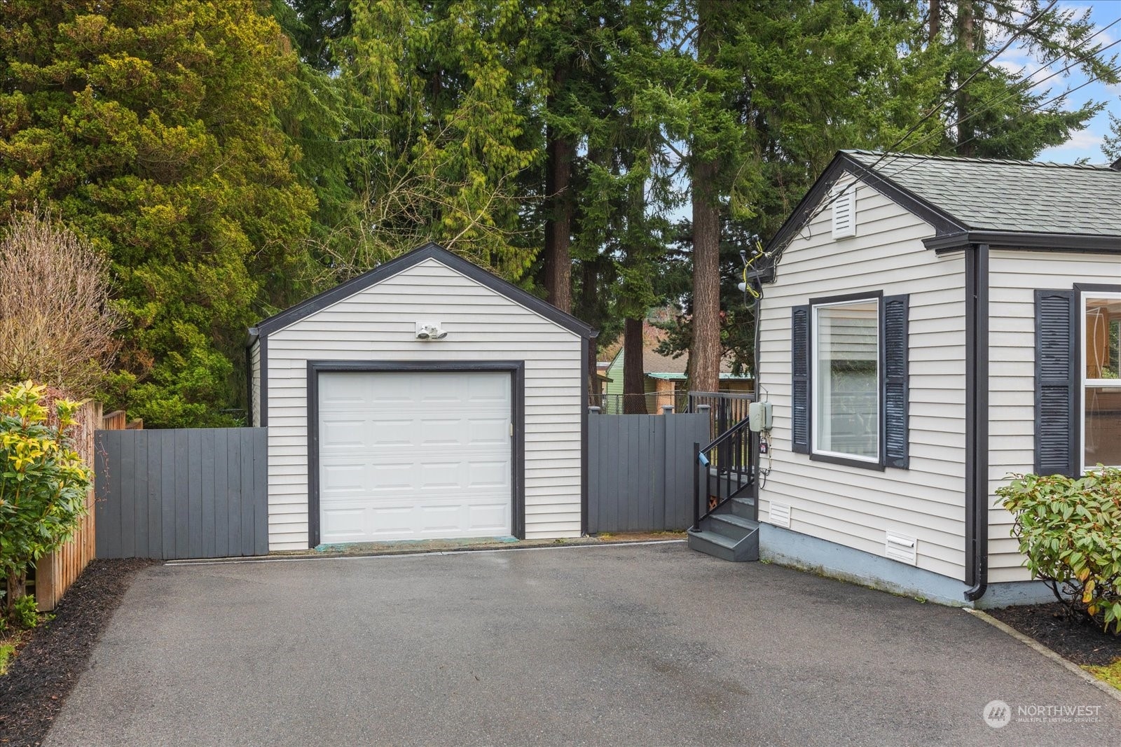 6919 Cady Road Everett, WA 98203 - Photo 2 of 39 a front view of a house with a garage