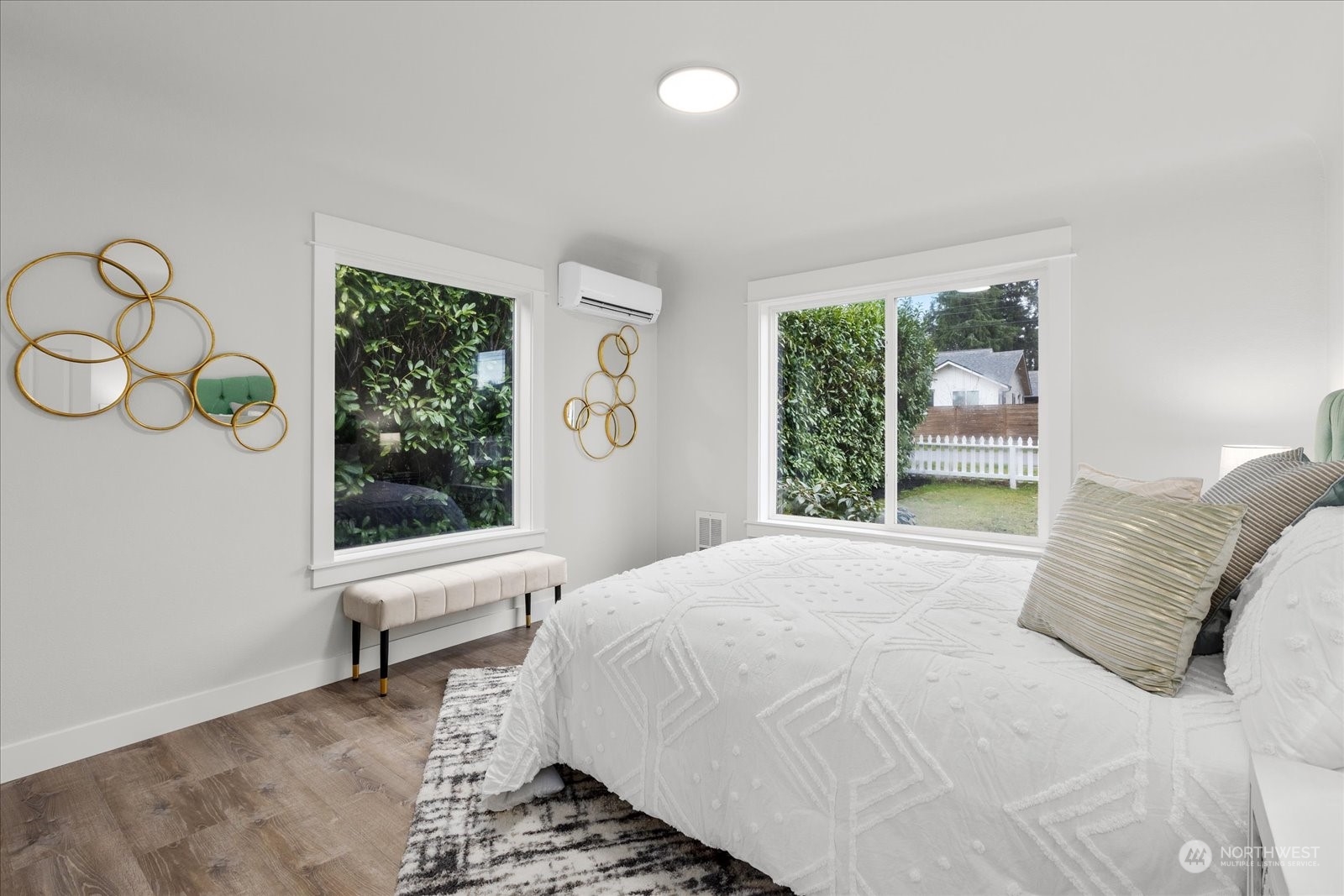 6919 Cady Road Everett, WA 98203 - Photo 27 of 39 a large white bed sitting in a room next to a window