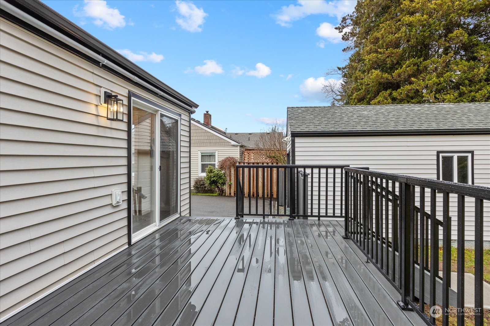 6919 Cady Road Everett, WA 98203 - Photo 29 of 39 a view of backyard with a deck and wooden floor