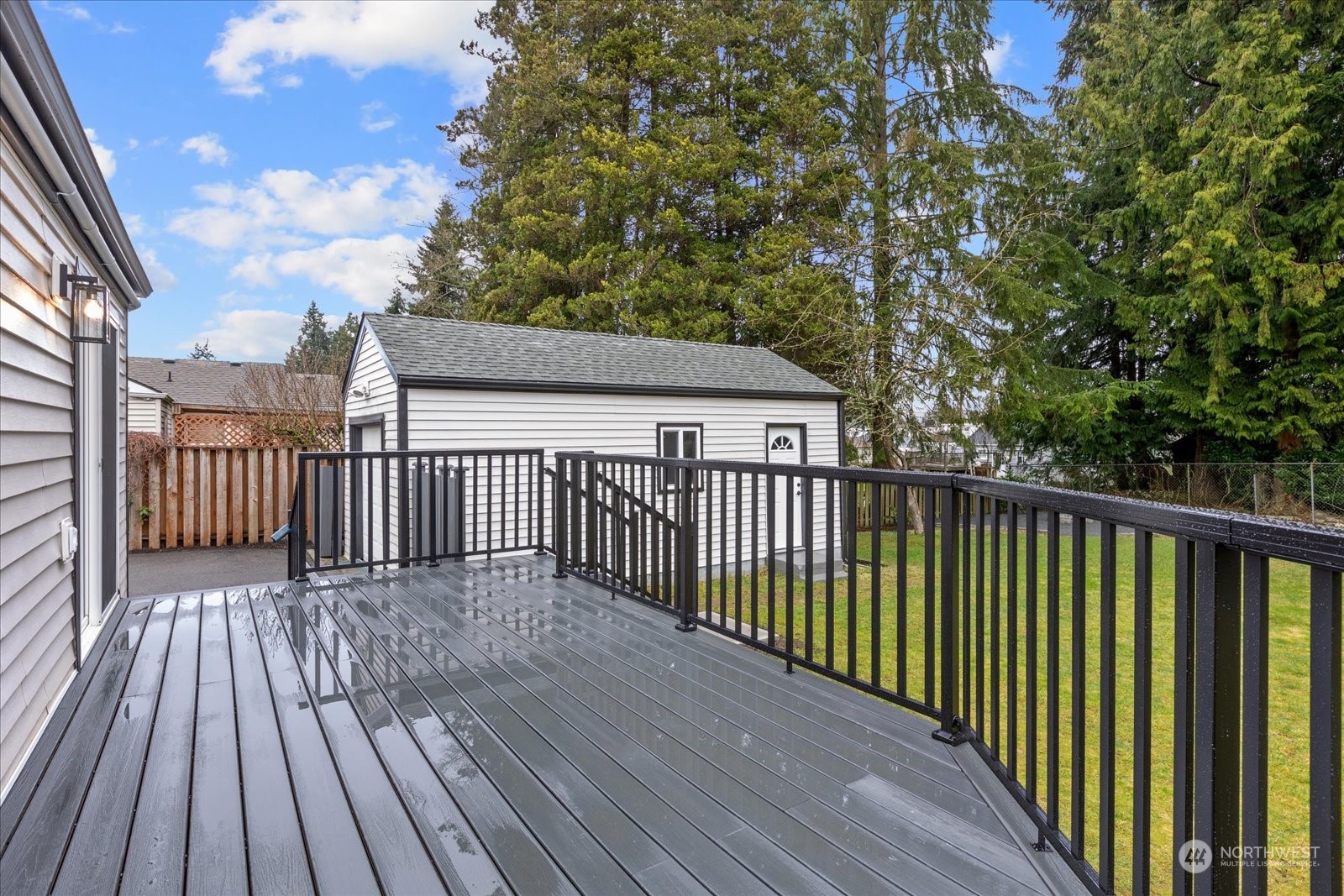 6919 Cady Road Everett, WA 98203 - Photo 30 of 39 a view of deck with wooden floor and fence