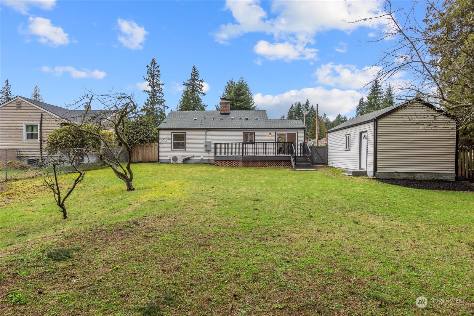 6919 Cady Road Everett, WA 98203 - Photo 32 of 39 a view of a house with a yard and sitting area