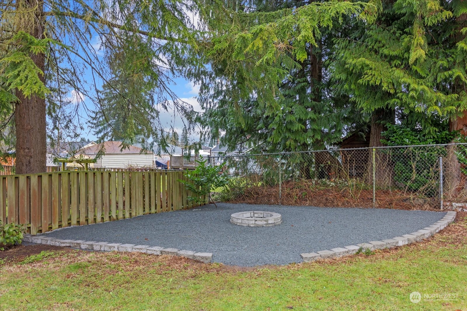 6919 Cady Road Everett, WA 98203 - Photo 36 of 39 a view of a backyard with iron fence