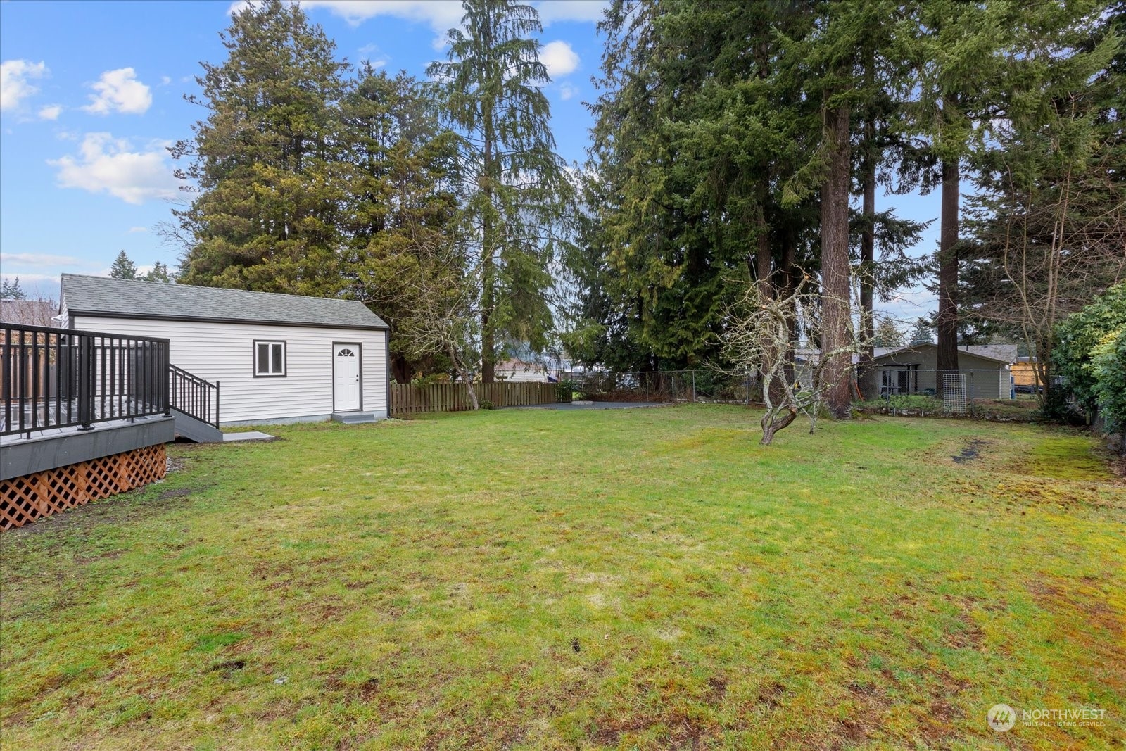 6919 Cady Road Everett, WA 98203 - Photo 37 of 39 a view of a house with backyard and tree