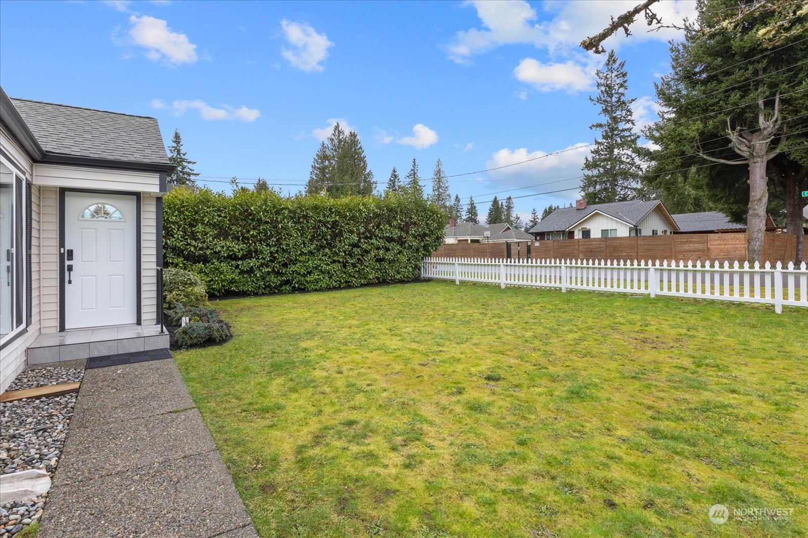 6919 Cady Road Everett, WA 98203 - Photo 39 of 39 a view of a house with a yard and a garden