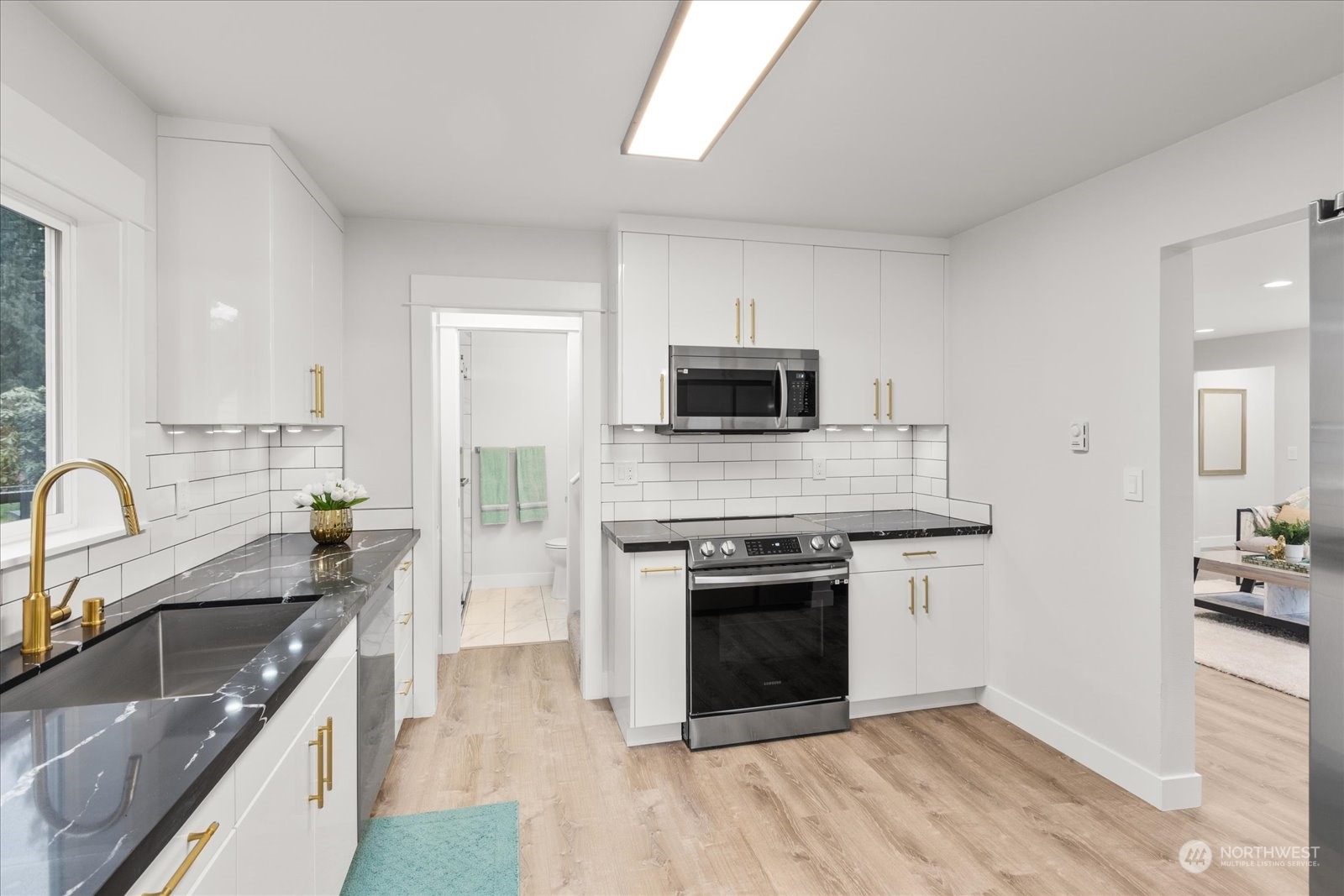 6919 Cady Road Everett, WA 98203 - Photo 8 of 39 a kitchen with a sink stove top oven and refrigerator