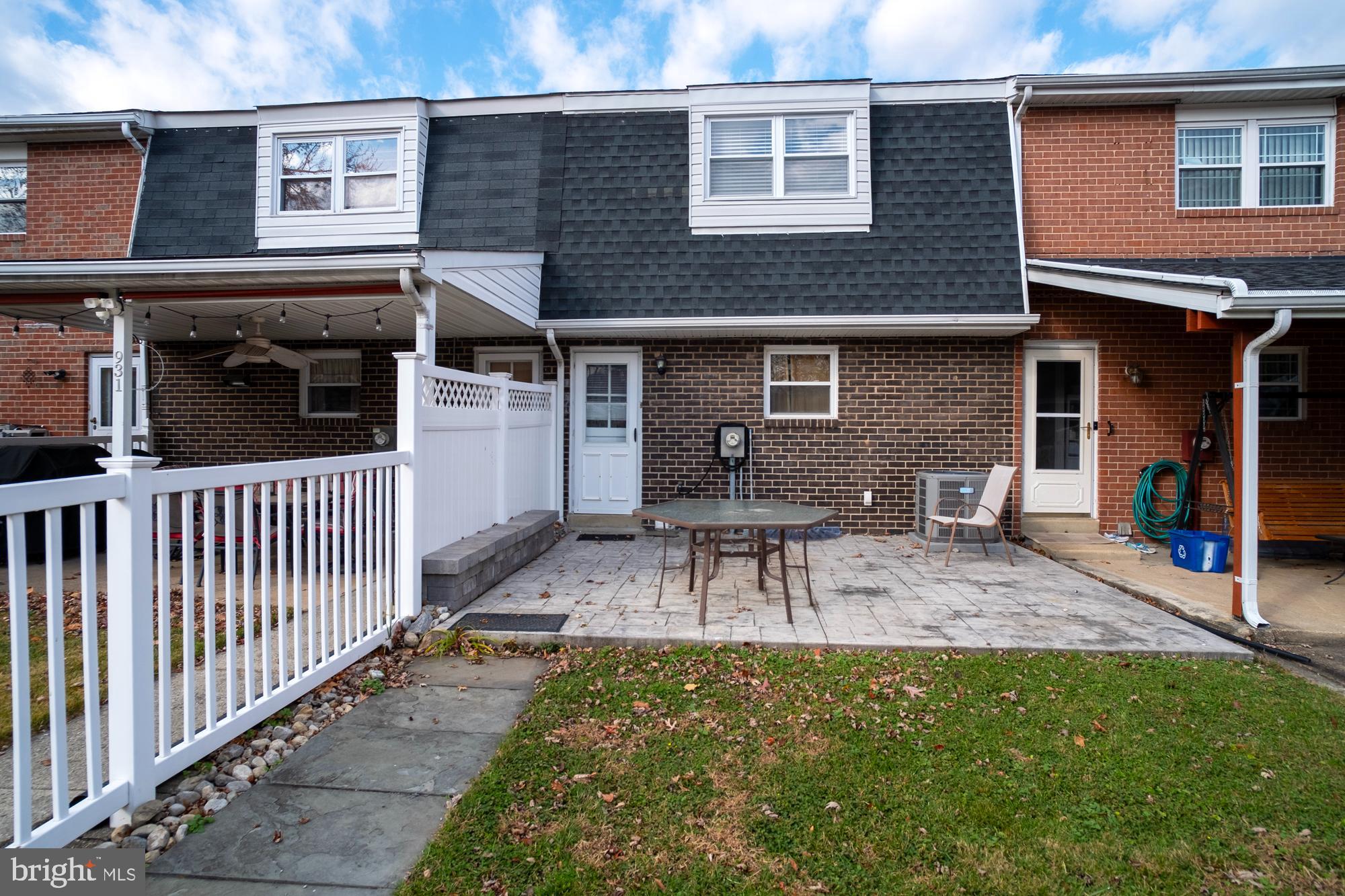 933 Elm Road Halethorpe, MD 21227 - Photo 11 of 11 a view of a house with a patio and a yard