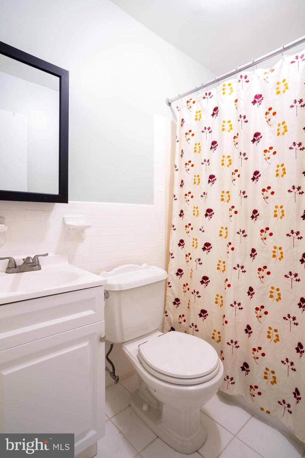 933 Elm Road Halethorpe, MD 21227 - Photo 6 of 11 a bathroom with a toilet and a sink