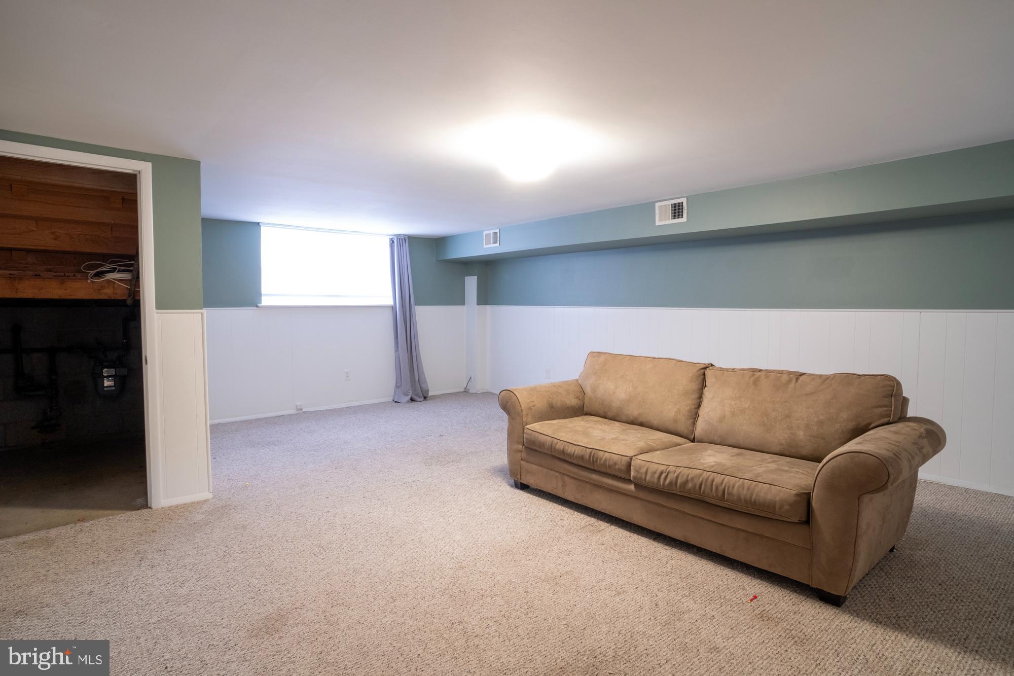 933 Elm Road Halethorpe, MD 21227 - Photo 8 of 11 a living room with furniture and a couch