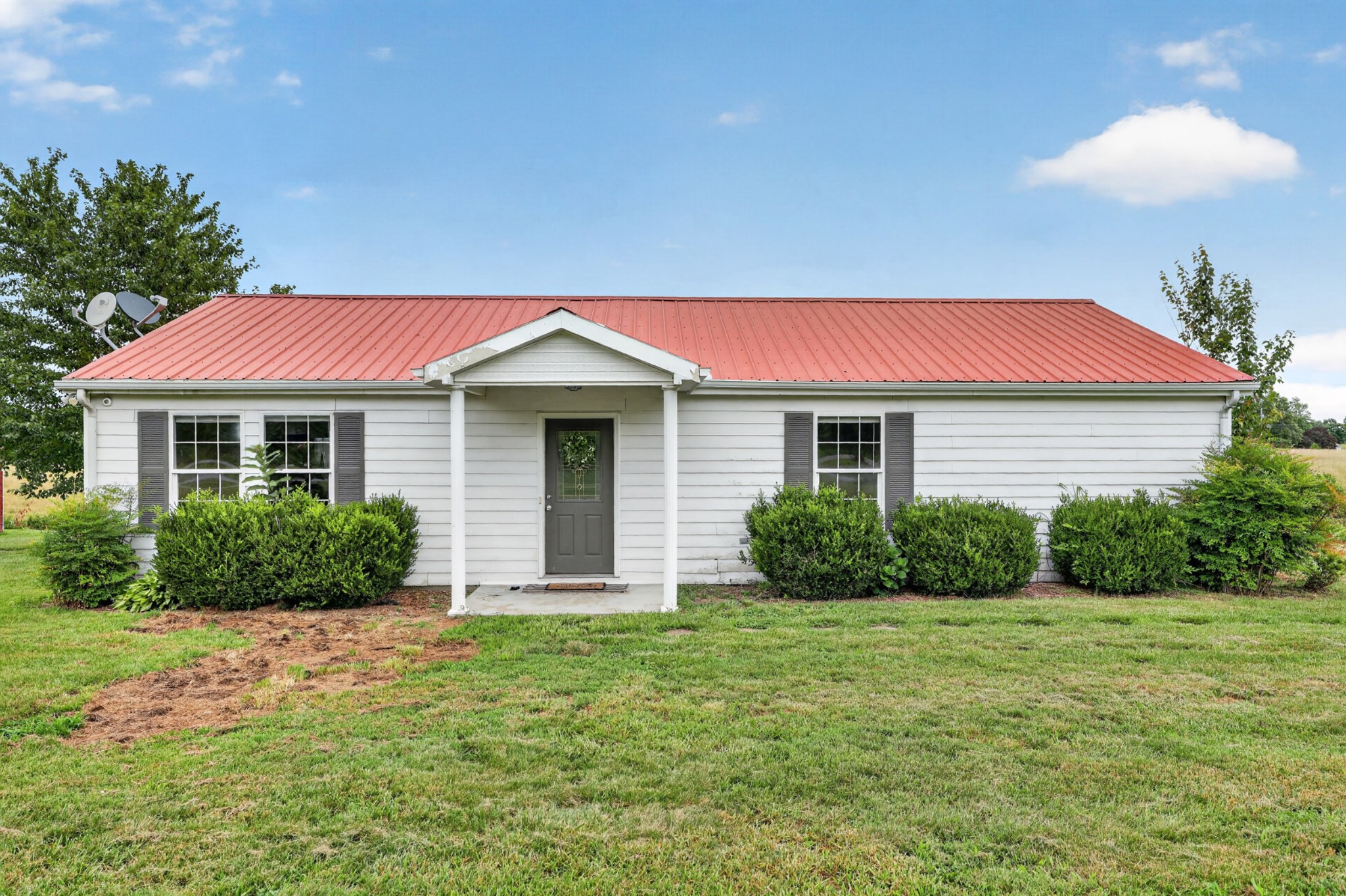 120 Driver Road Lafayette, TN 37083 - Photo 2 of 39 a front view of a house with a yard