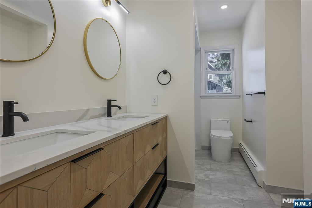 18 Ruth Lane Demarest, NJ 07627 - Photo 14 of 35 a bathroom with a granite countertop sink mirror and toilet