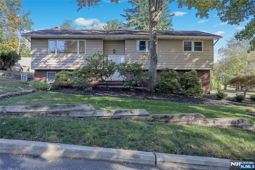 18 Ruth Lane Demarest, NJ 07627 - Photo 2 of 35 a front view of a house with a yard