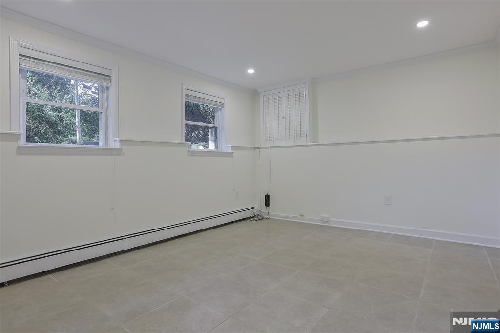 18 Ruth Lane Demarest, NJ 07627 - Photo 21 of 35 an empty room with a workbench