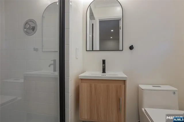 a bathroom with a sink and mirror