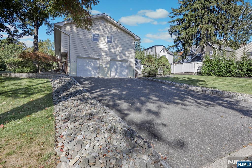18 Ruth Lane Demarest, NJ 07627 - Photo 31 of 35 a view of a yard with plants and trees