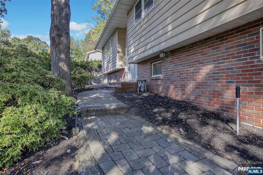 18 Ruth Lane Demarest, NJ 07627 - Photo 33 of 35 a backyard of a house with lots of green space