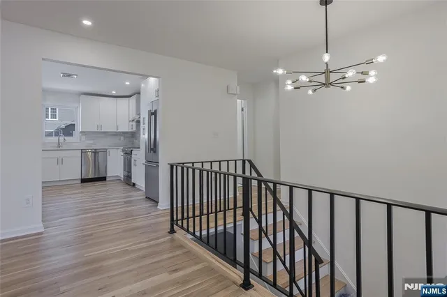 a view of a kitchen from the hallway