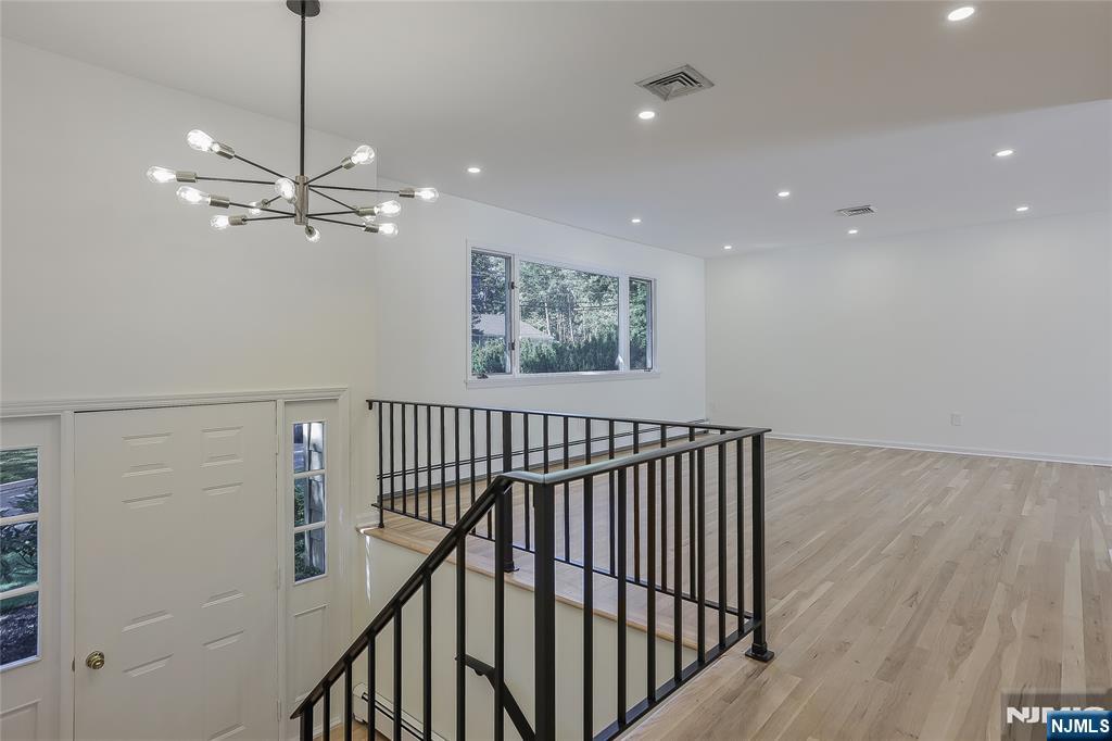 18 Ruth Lane Demarest, NJ 07627 - Photo 5 of 35 a view of entryway and hall with wooden floor