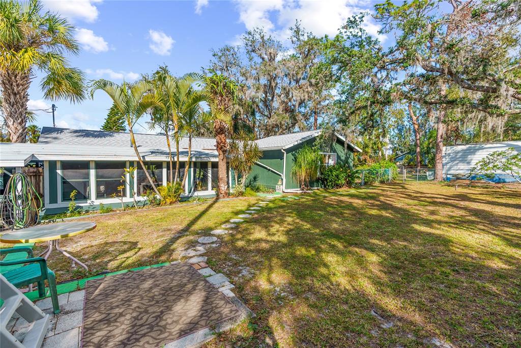 1285 Hagle Park Road Bradenton, FL 34212 - Photo 24 of 74 a view of a house with a backyard