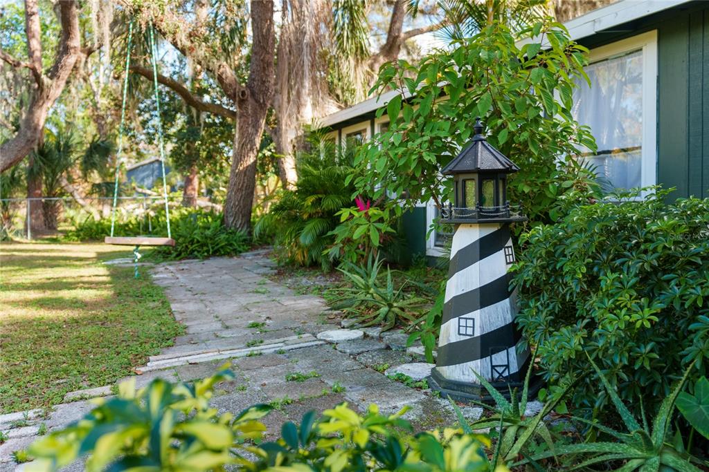 1285 Hagle Park Road Bradenton, FL 34212 - Photo 35 of 74 a backyard of a house with lots of green space