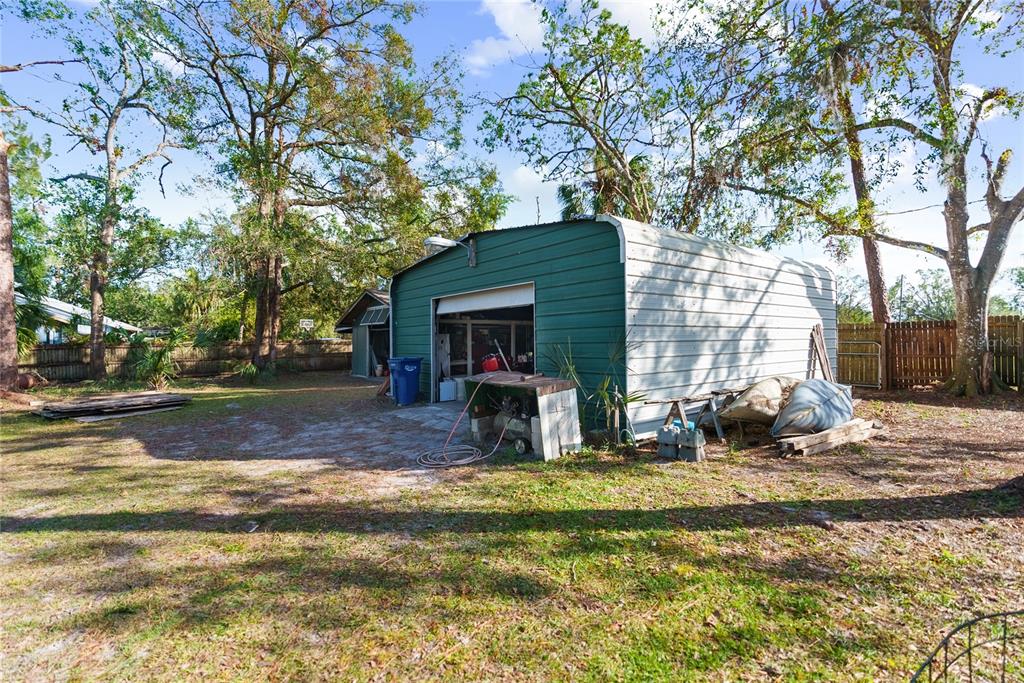 1285 Hagle Park Road Bradenton, FL 34212 - Photo 40 of 74 a view of a house with backyard porch and sitting area