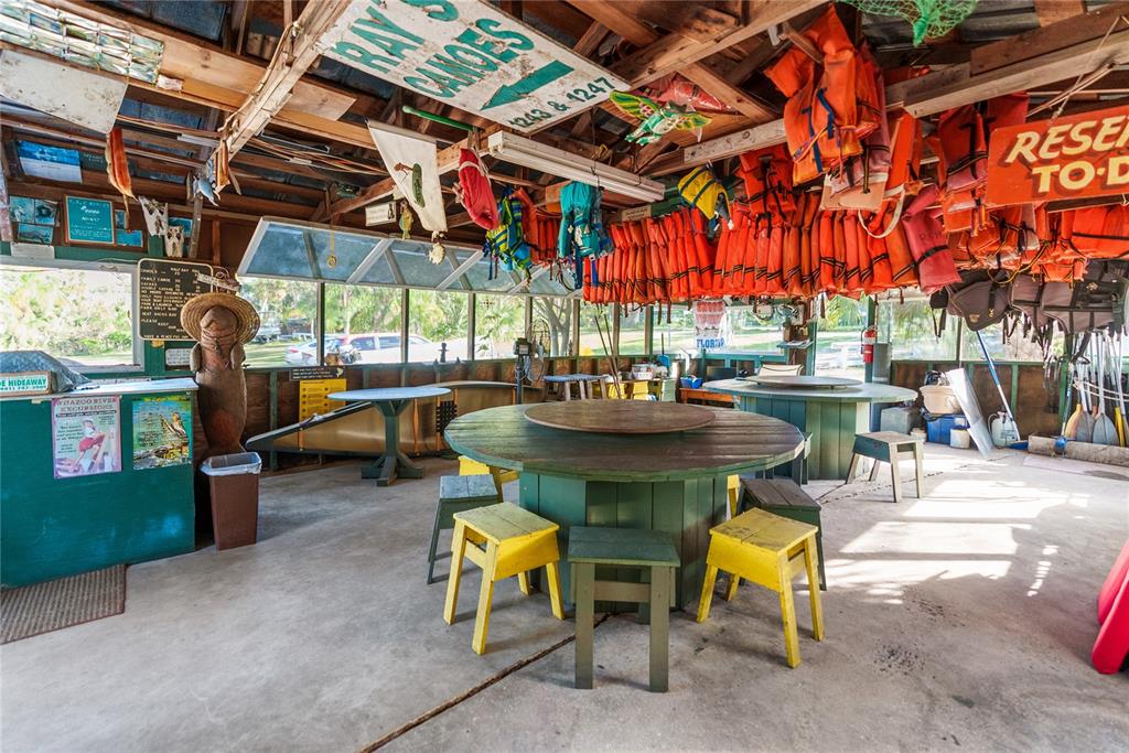 1285 Hagle Park Road Bradenton, FL 34212 - Photo 59 of 74 a view of a chairs and table in a patio