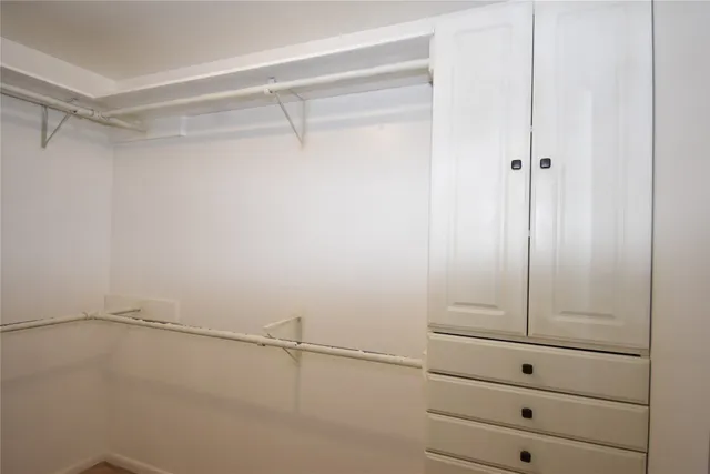 a view of an empty walk in closet