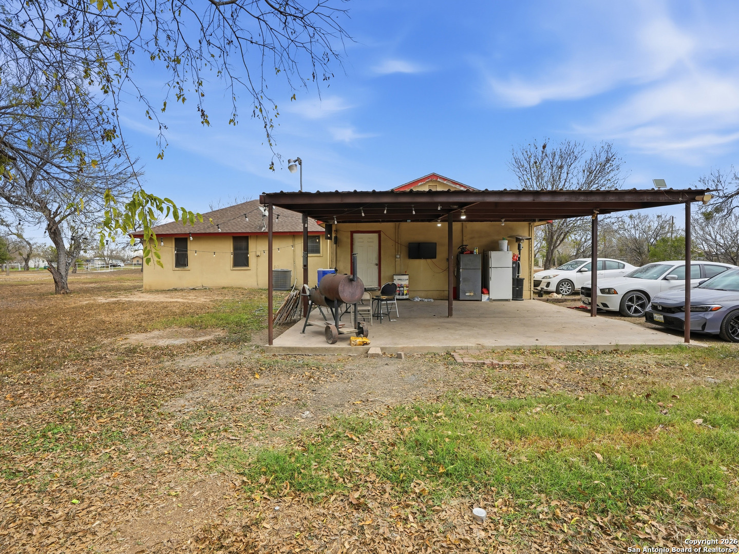 17525 Benton City Road Von Ormy, TX 78073 - Photo 27 of 36 a view of a house with a yard