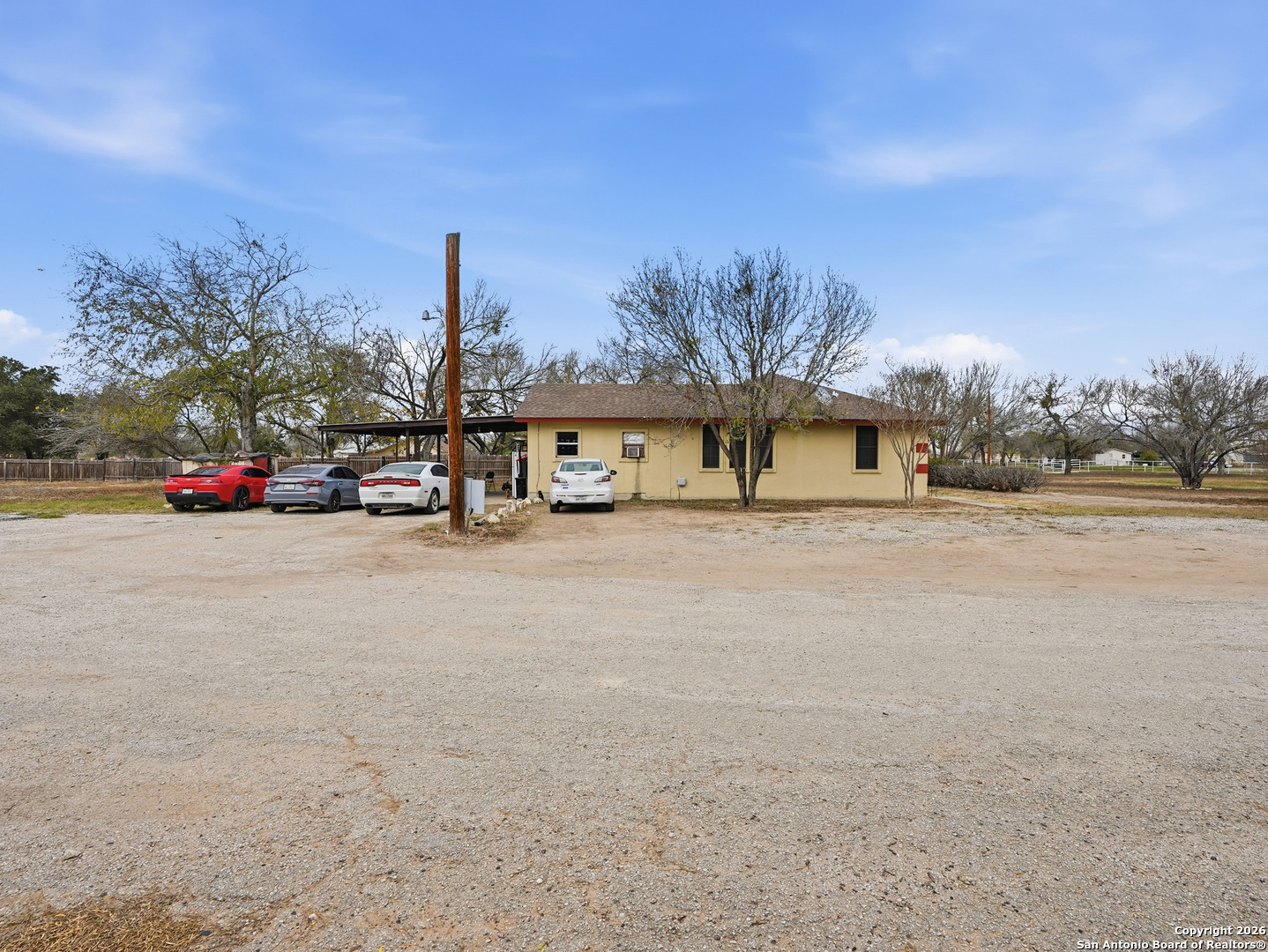 17525 Benton City Road Von Ormy, TX 78073 - Photo 29 of 36 a view of a street with cars on the road