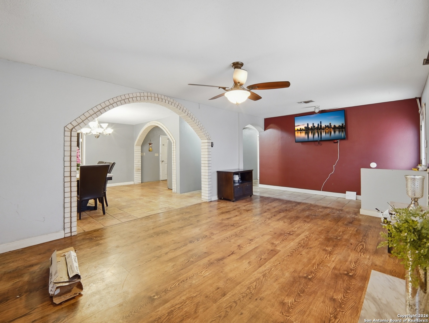 17525 Benton City Road Von Ormy, TX 78073 - Photo 4 of 36 a view of a livingroom with a furniture and a ceiling fan