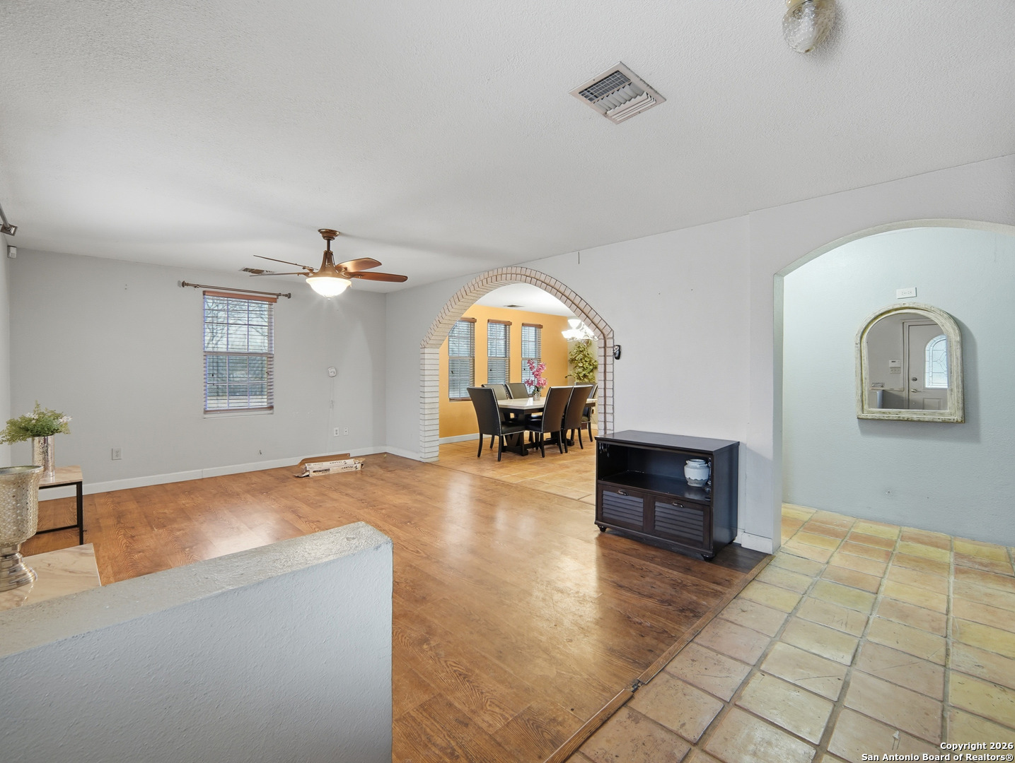 17525 Benton City Road Von Ormy, TX 78073 - Photo 8 of 36 wooden floor in an empty room with a window