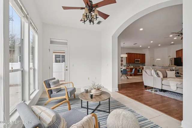 a swimming pool with outdoor seating and yard