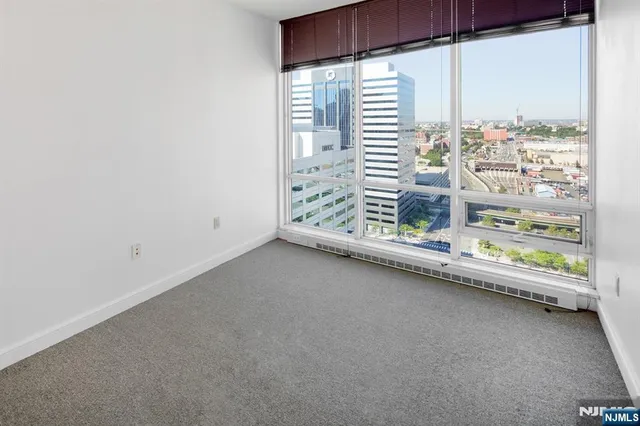 a spacious bathroom with a granite countertop sink a toilet and bathtub