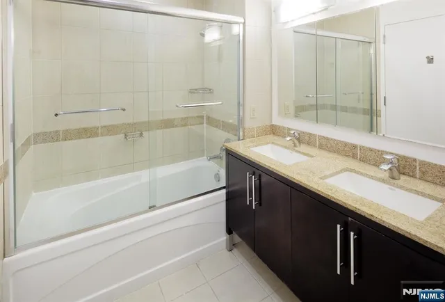 a terrace with outdoor seating and city view