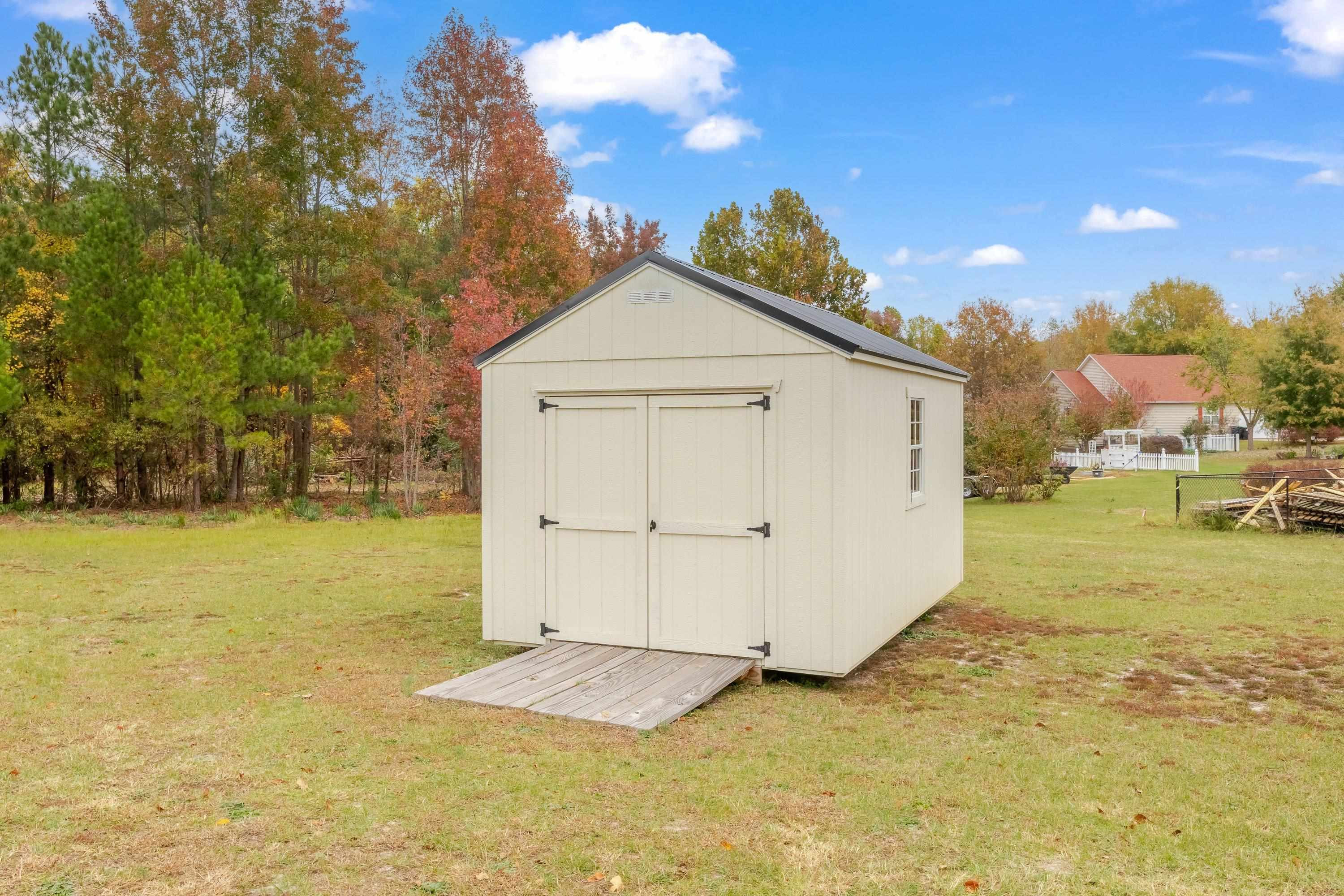 345 Axum Road Willow Spring, NC 27592 - Photo 34 of 38 Storage building conveys