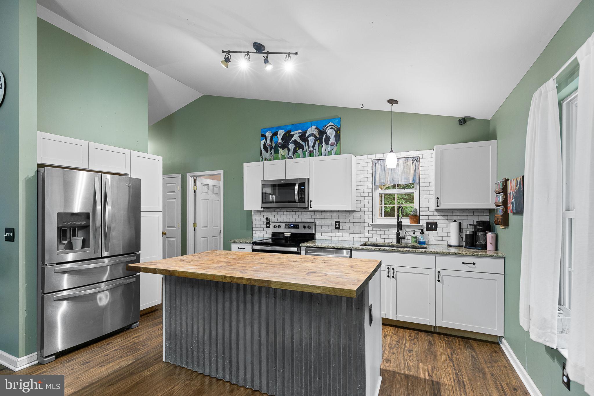 6199 Curtis Circle King George, VA 22485 - Photo 11 of 33 a kitchen with a sink stainless steel appliances a refrigerator and a sink
