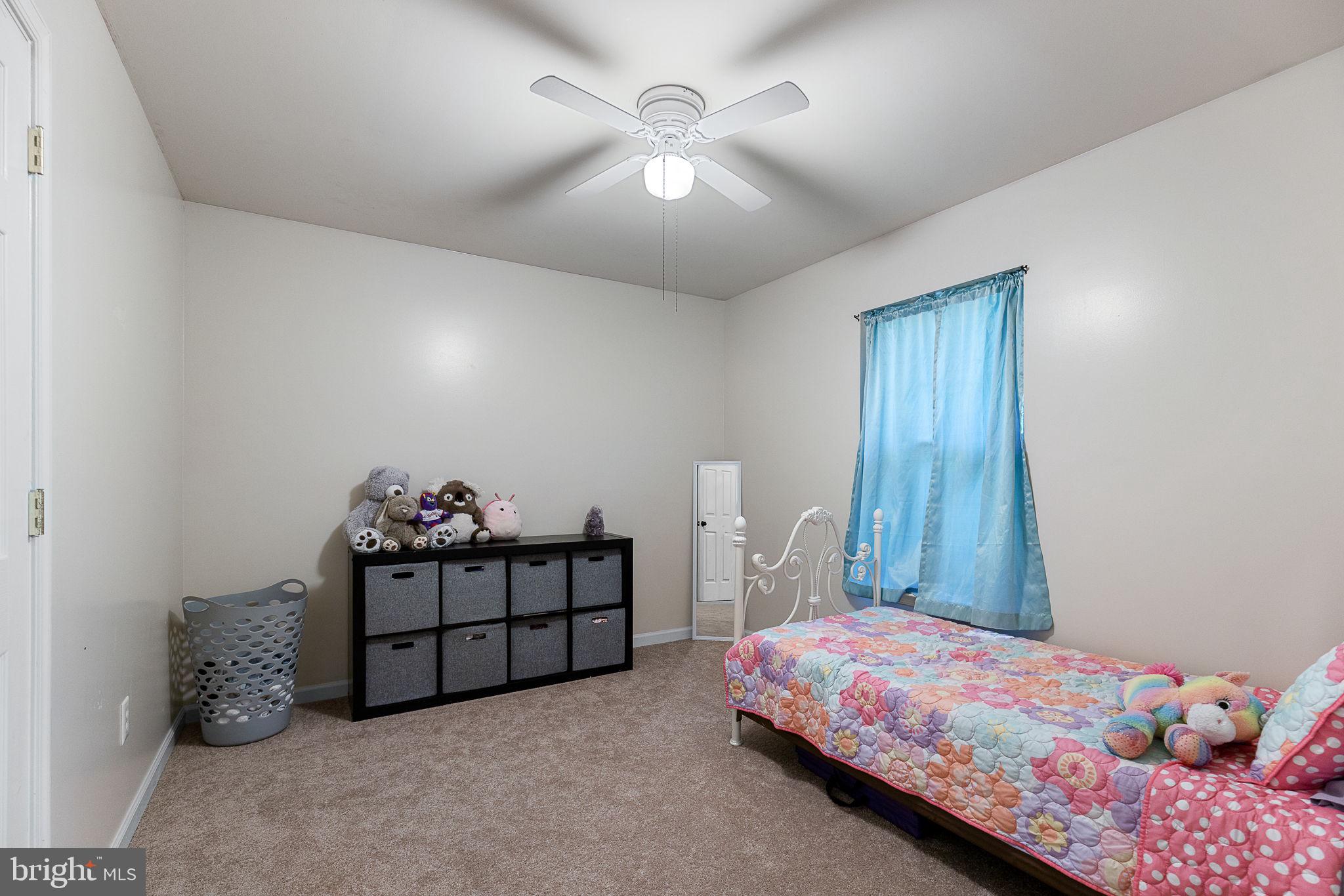 6199 Curtis Circle King George, VA 22485 - Photo 13 of 33 a bedroom with bed and window