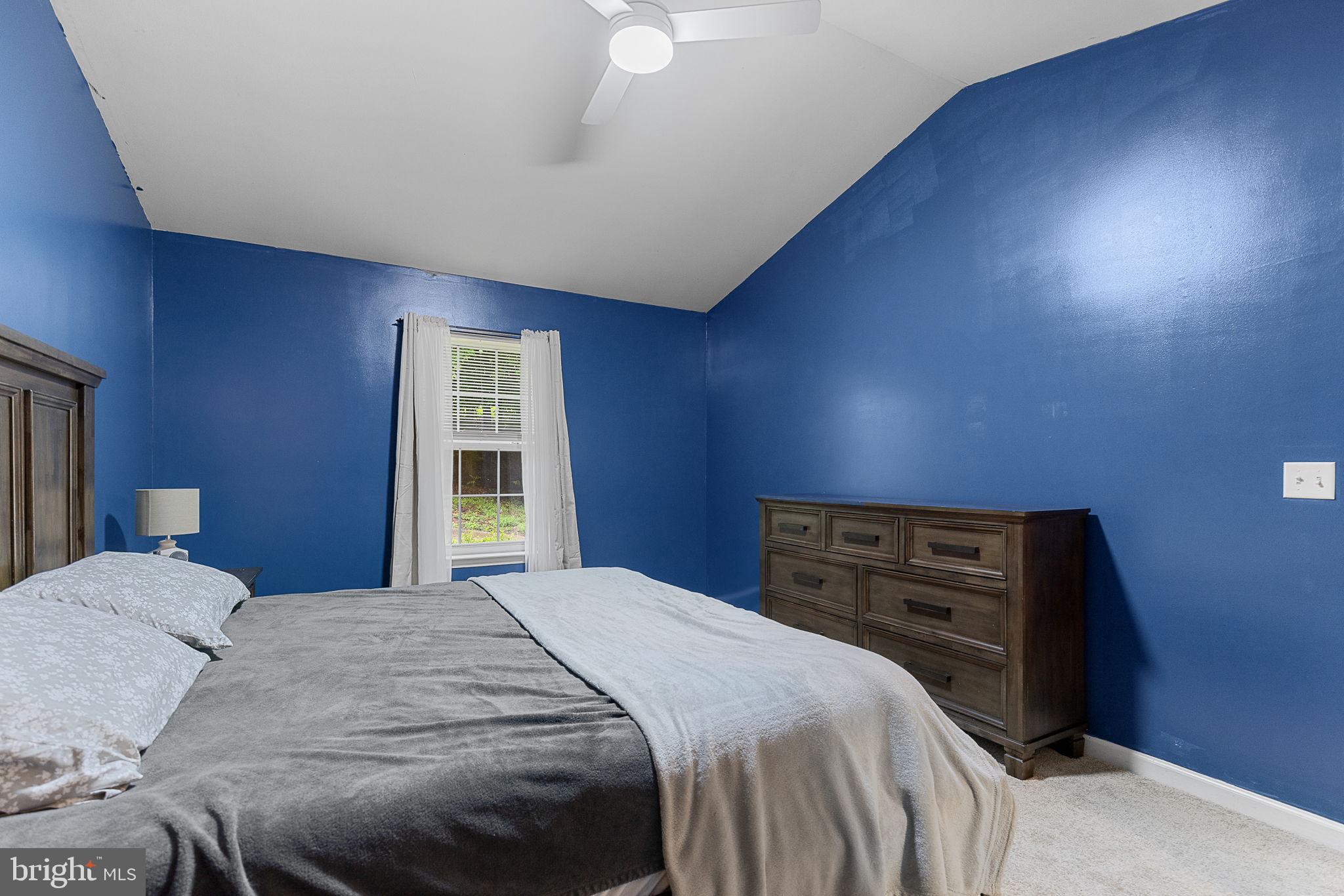 6199 Curtis Circle King George, VA 22485 - Photo 15 of 33 a bedroom with a bed and a dresser