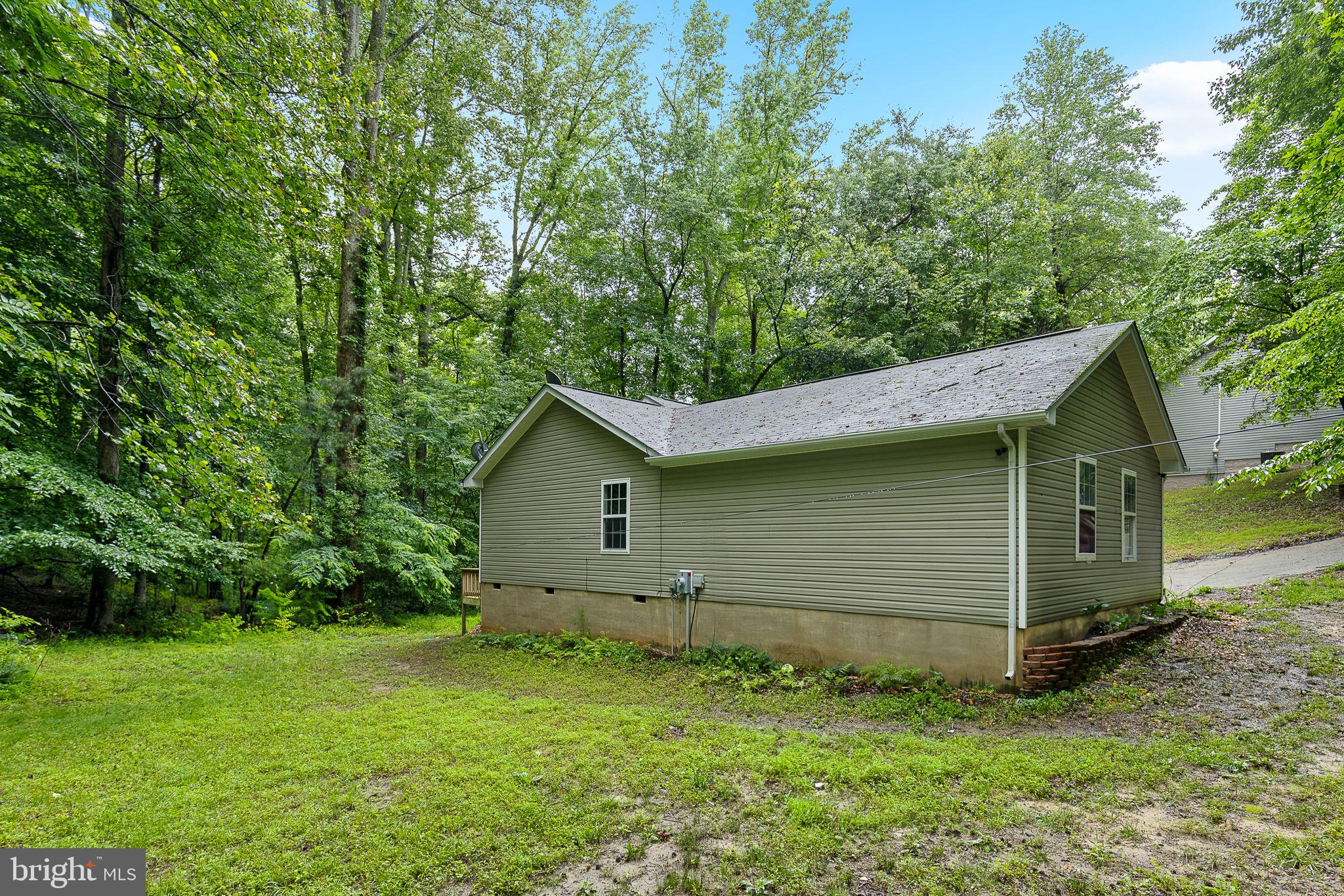 6199 Curtis Circle King George, VA 22485 - Photo 18 of 33 a view of backyard of house with green space
